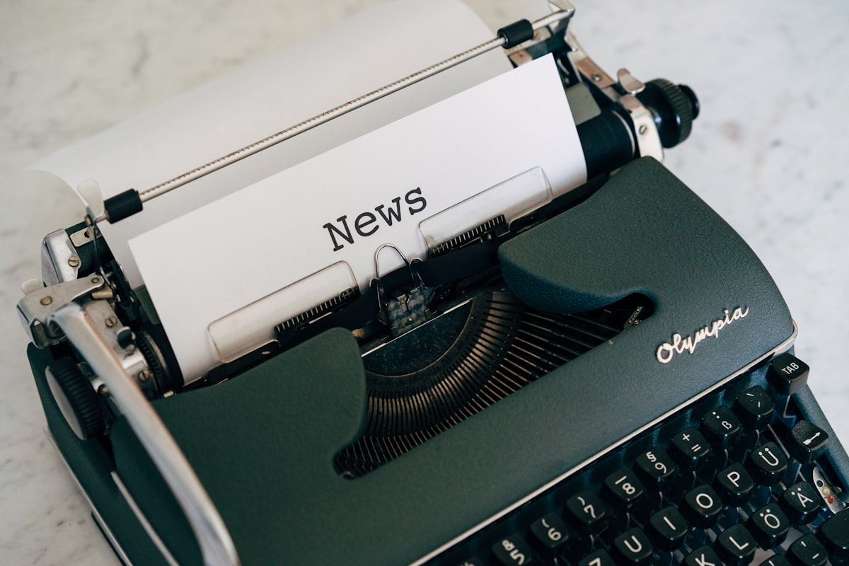 A classic typewriter with a sheet of paper reading News